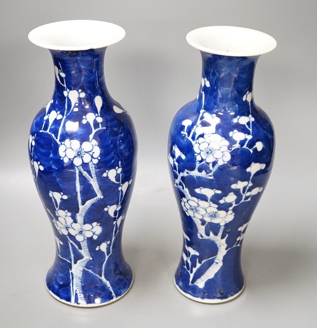 Two 19th century Chinese blue and white prunus vases, 31cm